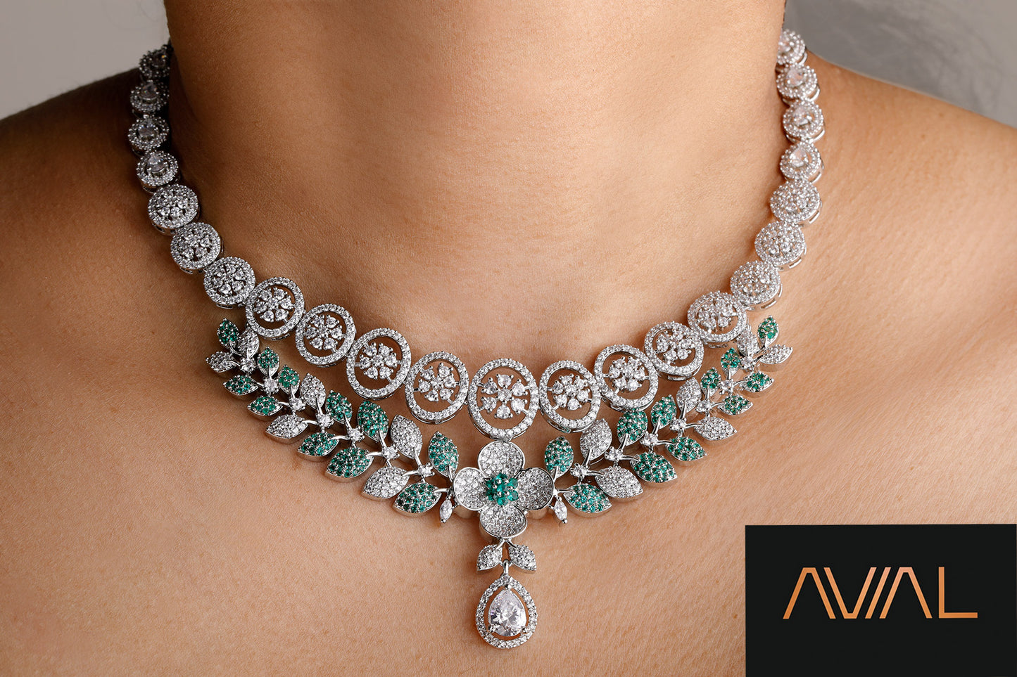 Close-up of green and white floral necklace with sparkling American diamonds and emerald accents – perfect for UK wedding and party looks