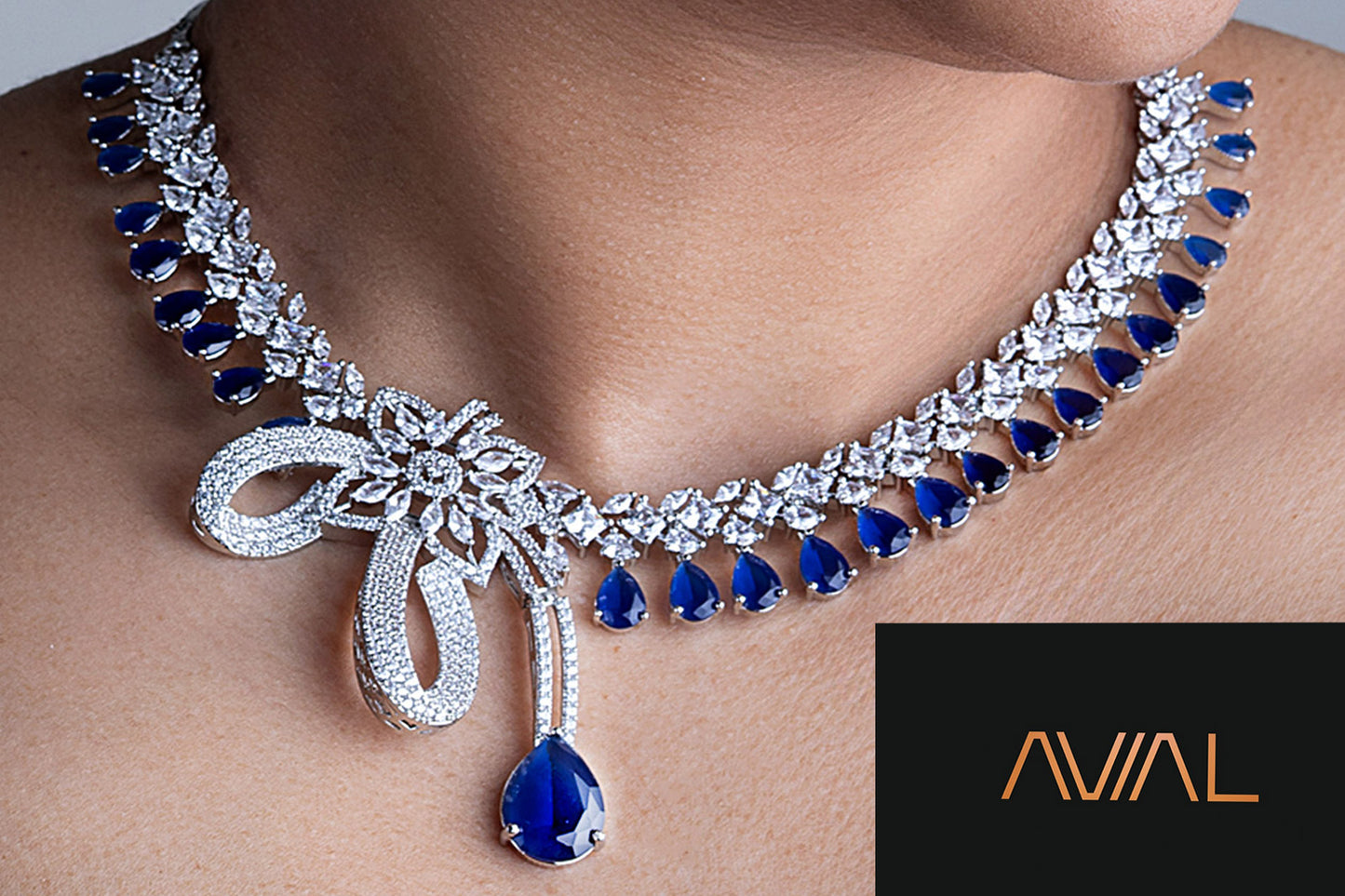 Close-up of royal blue necklace with silver finish and American diamond work – Indian wedding jewellery UK