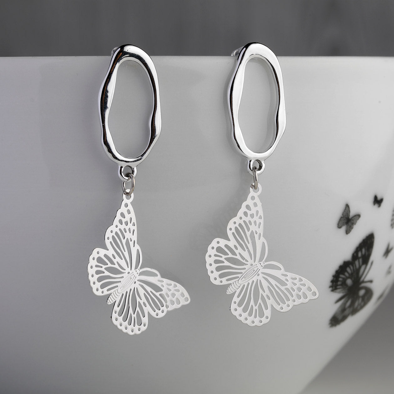 Heartline Glow Drops - Dainty butterfly shaped drops earrings silver finish