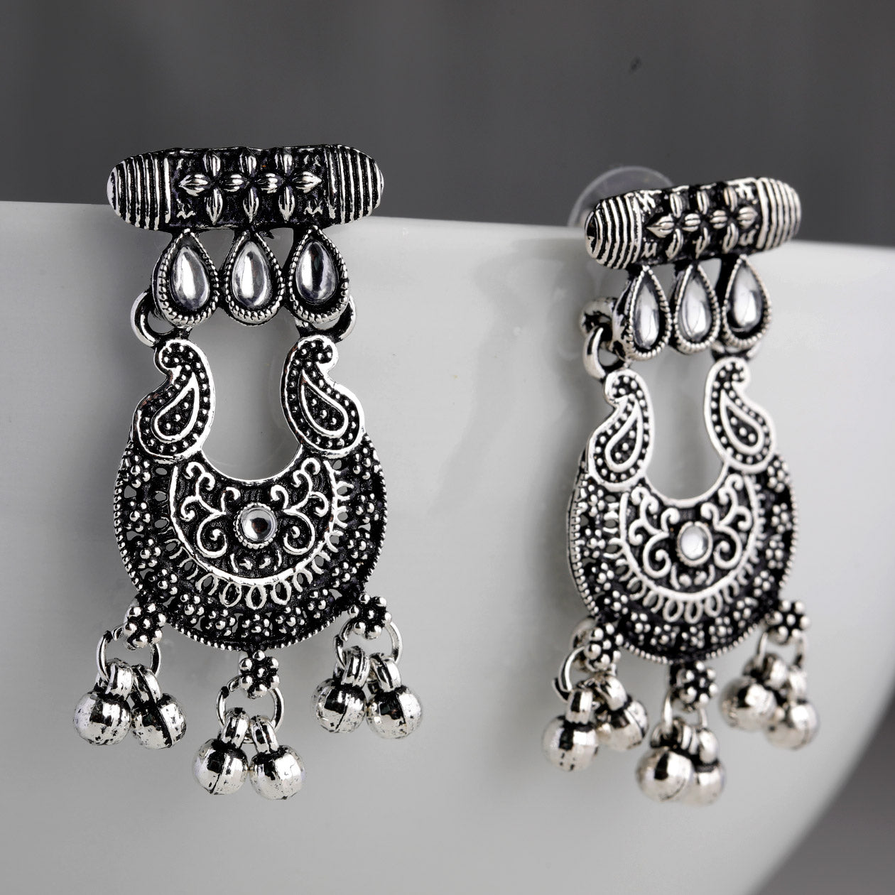 Bring a touch of vintage charm to your look with these oxidised look finish earrings clear