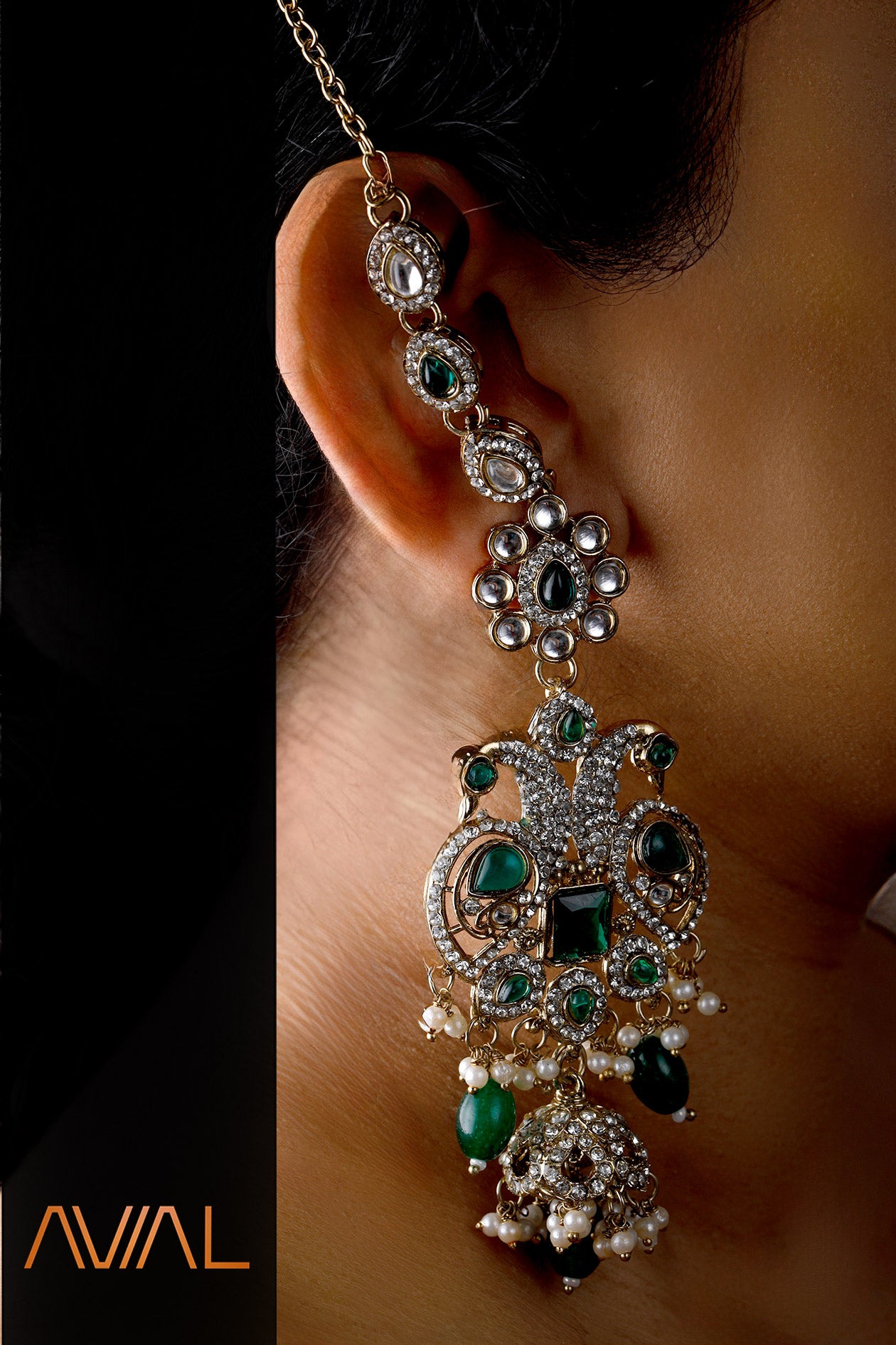 Traditional Indian bridal jewelry with jhumka earrings and head chain