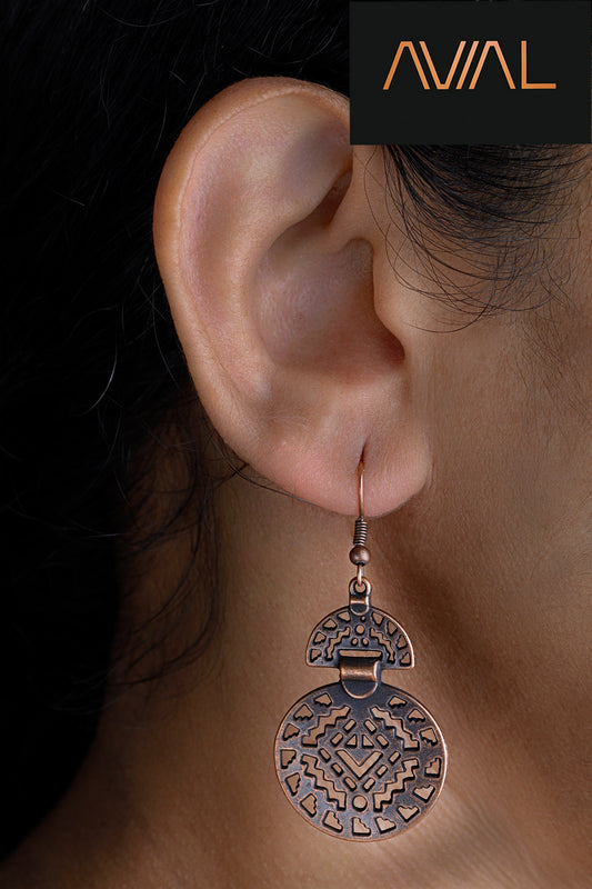 Model wearing antique bronze boho earrings with tribal geometric carving – handmade ethnic hook dangle jewellery for women