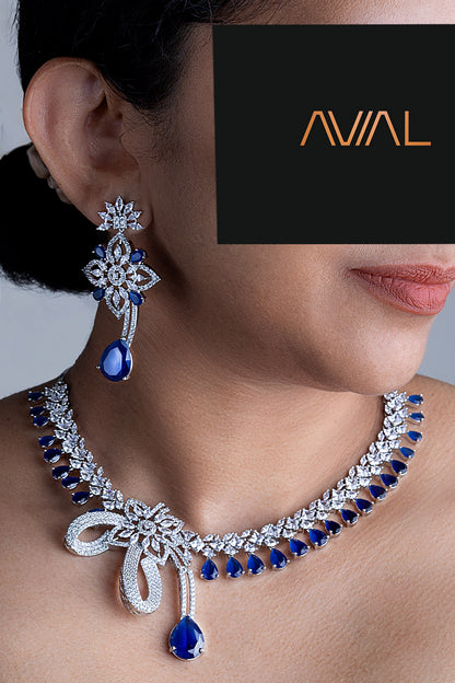 Model wearing royal blue American diamond necklace set with matching drop earrings in silver finish – Avial Stores UK