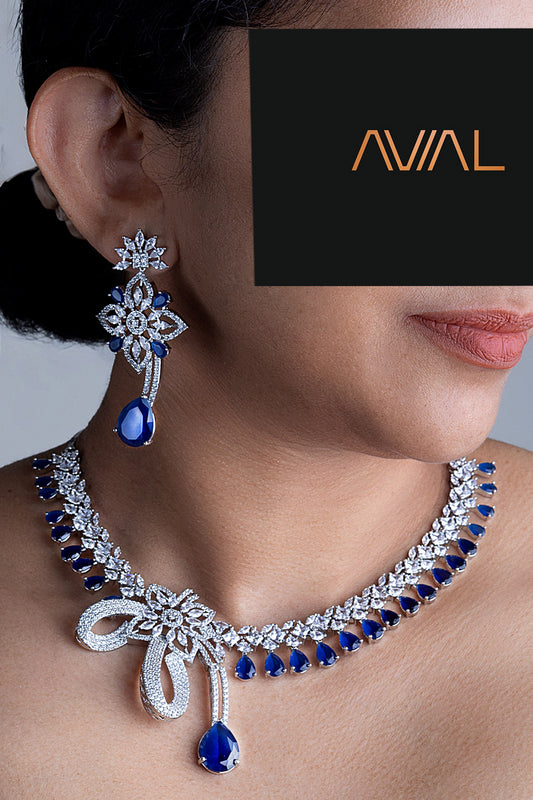 Model wearing royal blue American diamond necklace set with matching drop earrings in silver finish – Avial Stores UK