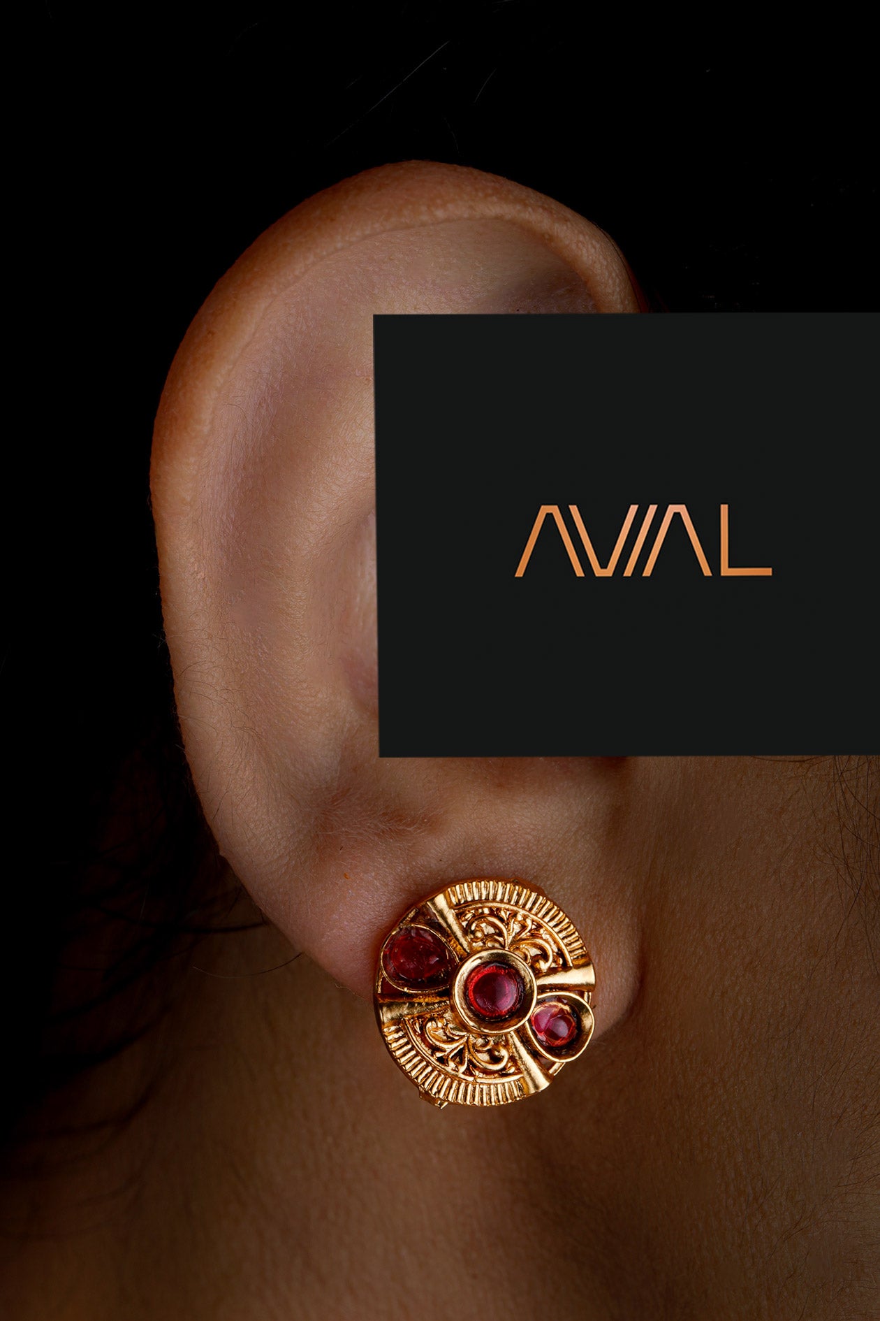 Traditional gold-tone stud earrings with red stones in circular design – South Indian heritage jewellery UK