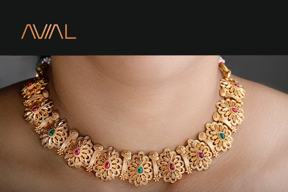  Traditional gold-plated floral choker necklace with red and green stones, ideal for festive and bridal wear in the UK