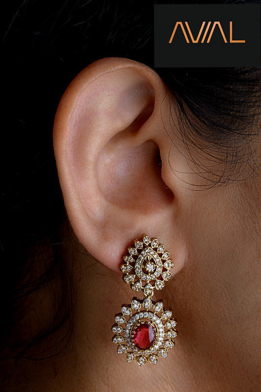 Woman wearing Desi Dusk antique gold earrings with red stone and kundan-style detailing – perfect for South Indian festive looks in the UK