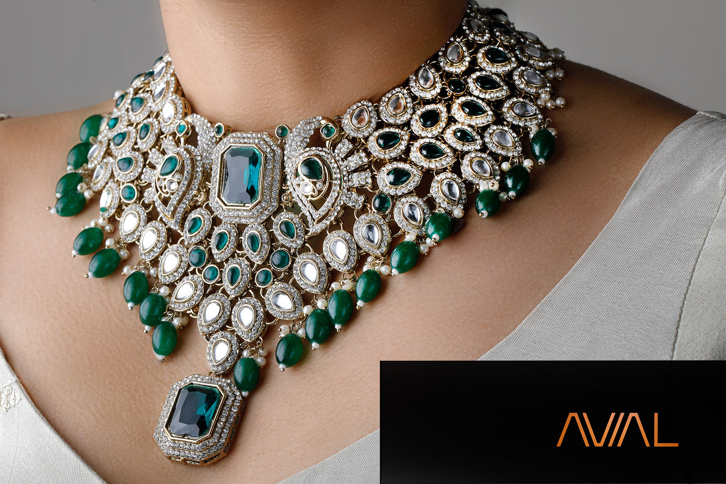 Close-up of polki-style Indian bridal choker necklace with green stones