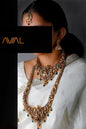 Complete South Indian bridal temple jewelry set in antique gold featuring Lakshmi choker, long haar, earrings, and maang tikka