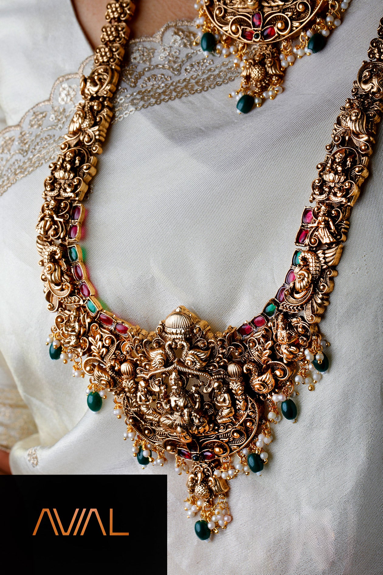 South Indian long temple haar necklace with traditional goddess motif and colourful gemstone accents