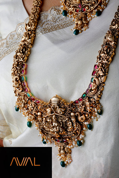 South Indian long temple haar necklace with traditional goddess motif and colourful gemstone accents