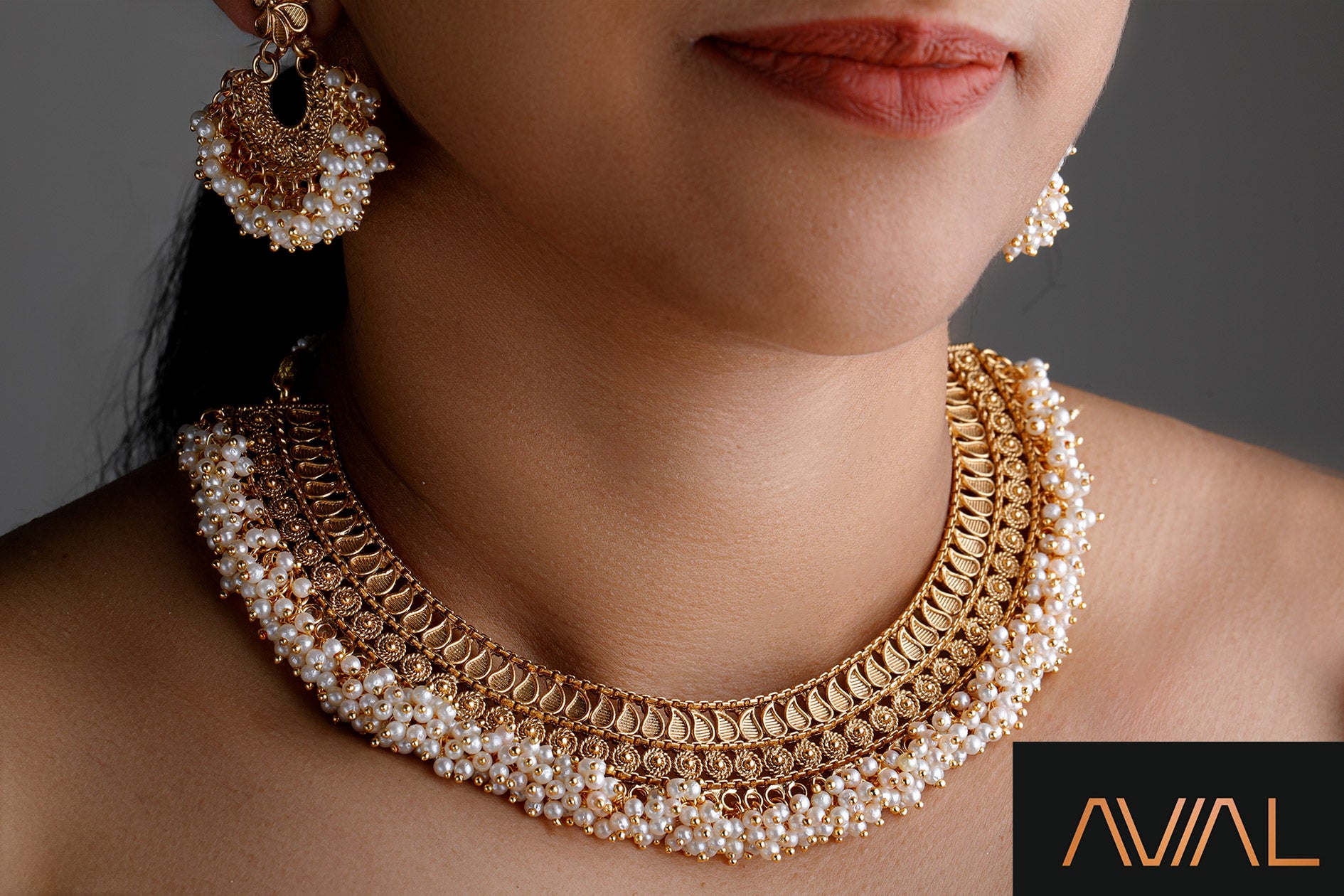 Short South Indian temple-style necklace with antique gold finish and pearl embellishments
